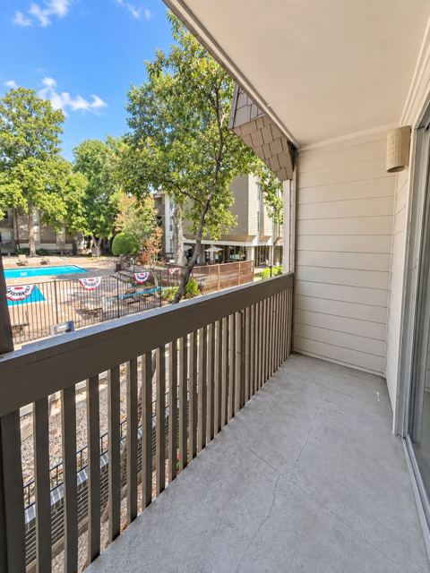 Covered balcony overlooking the pool