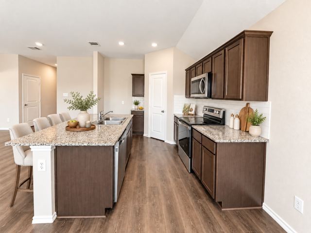 Kitchen, second view, virtually staged (virtually staged photo, furniture and decor added digitally)